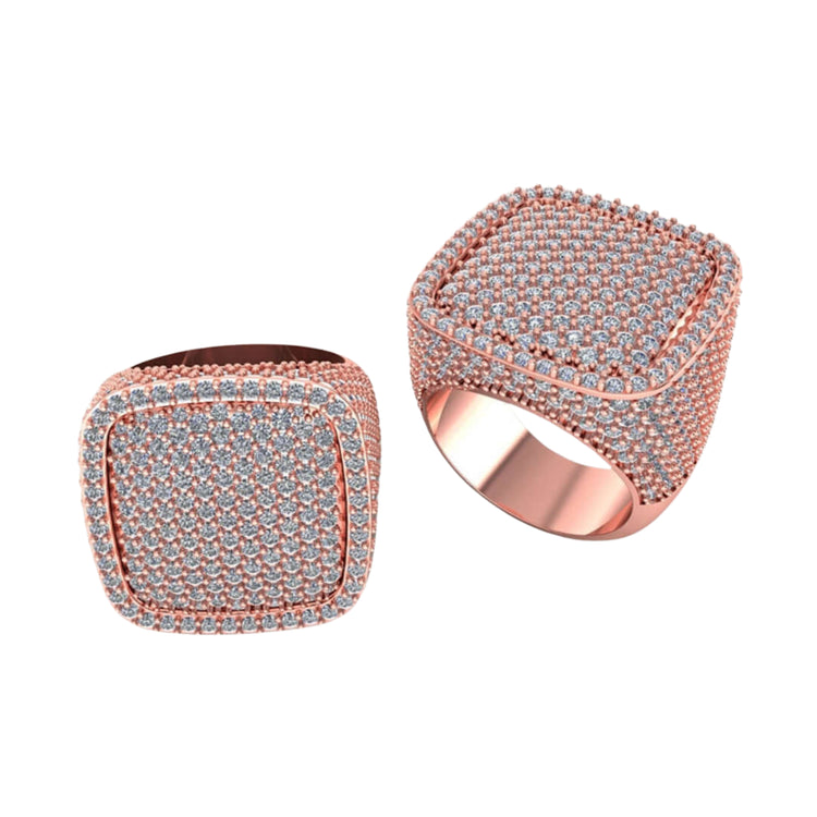 Two Iced Cushion Diamond Rings – 6.48 CT Pavé Design in rose gold, each with a square face and pavé-set diamonds on the top and sides, are displayed on a white background.