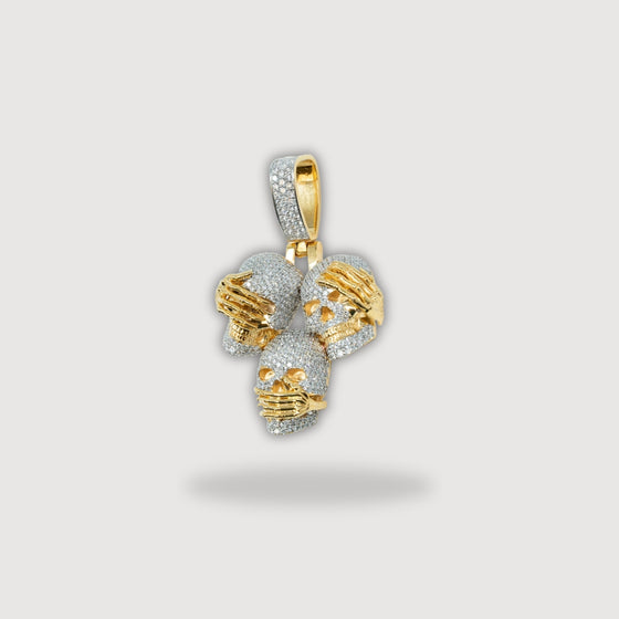 14k gold skull pendant featuring Hear No Evil, See No Evil, Speak No Evil design with intricate craftsmanship and solid gold accents.