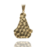 The Caridad Del Cobre Pendant with CZ Stones, crafted in 14k solid yellow gold, features an abstract teardrop-inspired design and textured swirls, photographed on a white background with a subtle reflection below.