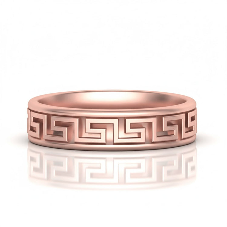 The 14k Gold Men's Greek Key Band Ring showcases an intricate Greek key pattern engraved around the band, presented on a white background with a subtle reflection below.