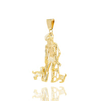 The Saint Lazarus Pendant – 14K Gold Men’s Pendant shows a standing man in a hat with two small dogs at his feet. This detailed, textured religious piece is displayed on a white background with a subtle reflection below.