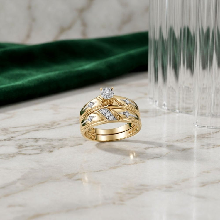 10k Gold Diamond Matching Wedding Ring Set, featuring a beautiful diamond wedding band, displayed on a marble surface with a green velvet cloth and a clear ribbed glass in the background.
