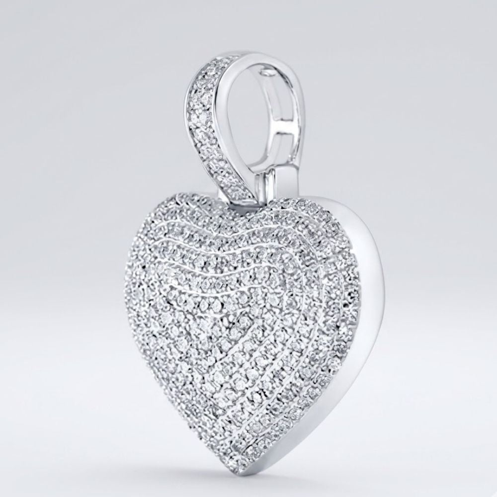 A dazzling 10K Gold Diamond Heart Pendant 3/4 Cttw Charm features multiple rows of sparkling diamonds and a gem-studded bail, displayed against a plain light gray background.
