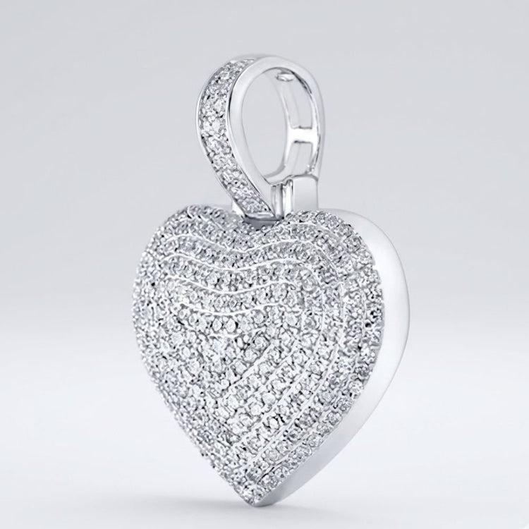 A dazzling 10K Gold Diamond Heart Pendant 3/4 Cttw Charm features multiple rows of sparkling diamonds and a gem-studded bail, displayed against a plain light gray background.