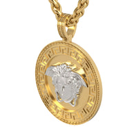 14k Two-Tone Gold Medusa Pendant: Round pendant with a silver Medusa head at the center and a Greek key border, paired with a gold chain necklace.
