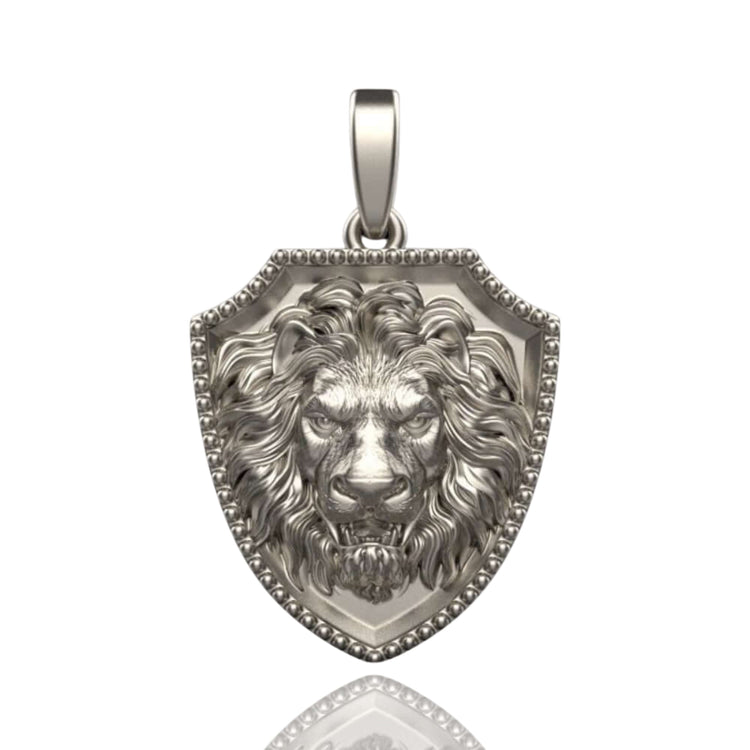 The 14k Gold Lion Shield Pendant is shaped like a shield and features a detailed, three-dimensional lion's head with a fierce expression and flowing mane.