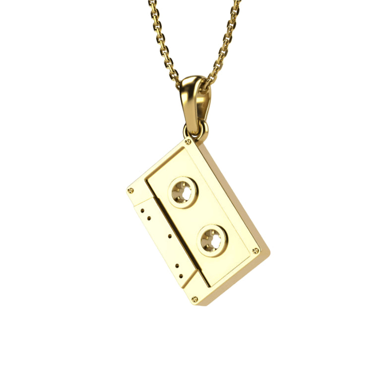 The 14k Gold Cassette Tape Pendant necklace is a vintage-inspired jewelry piece, perfect for music lovers. Photographed on a plain white background.