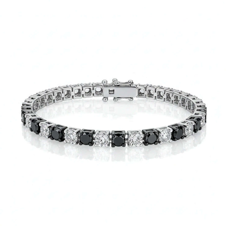 The Black Moissanite Tennis Bracelet - 4mm, crafted from 925 sterling silver and set with striking black moissanite stones, brings modern elegance to any outfit.