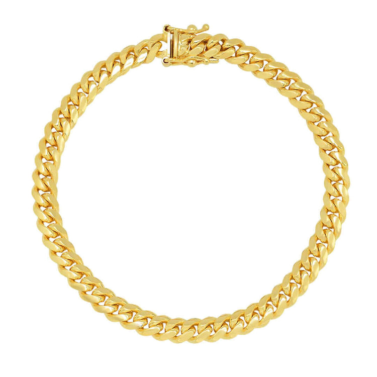 The Cuban Link Bracelet - 6mm features a circular design, polished finish, and secure clasp—crafted in solid gold to add timeless sophistication to any outfit.