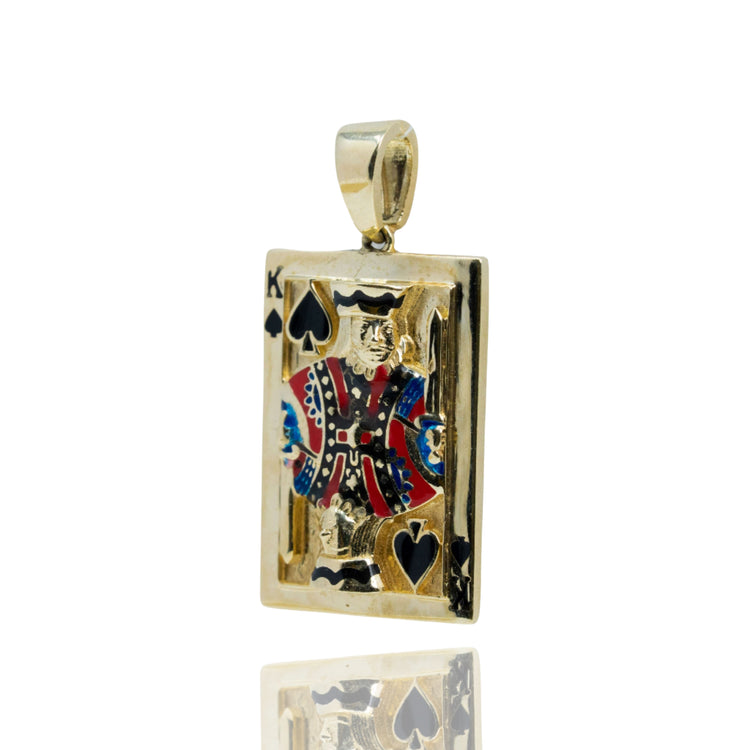 The King of Spades Card Pendant in 10K Gold – Men's Gold Pendant features a gold King of Spades card design with vibrant red, blue, black, and white accents on the king and a reflective surface below.