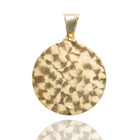 The Circular Caridad Del Cobre, Lady of Charity Pendant in 14k solid yellow gold features a textured, hammered round design with a smooth bail, shown against a white background—perfect for elegant religious jewelry lovers.