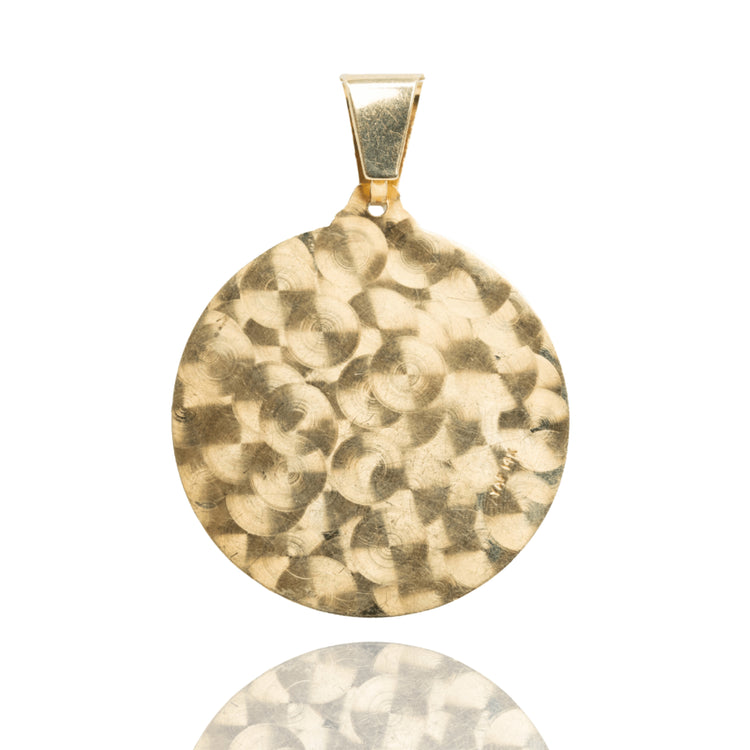 The Circular Caridad Del Cobre, Lady of Charity Pendant in 14k solid yellow gold features a textured, hammered round design with a smooth bail, shown against a white background—perfect for elegant religious jewelry lovers.