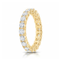 The 5/8CTW Natural Diamond Ana M Eternity Band in 14k gold features round, brilliant-cut natural diamonds set all around the band.