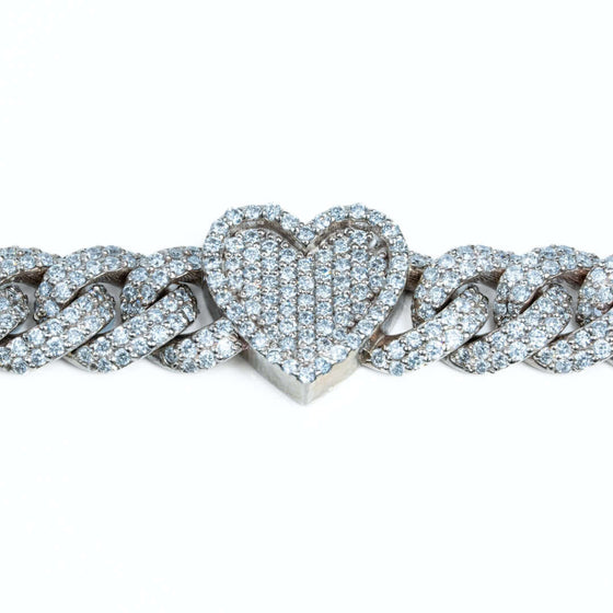 Diamond Heart Cuban Link Bracelet Dazzling 6ct diamond heart Cuban link bracelet in 10k gold. SI+ natural diamonds sparkle on this bold 7" statement piece. Shop luxurious diamond bracelets!