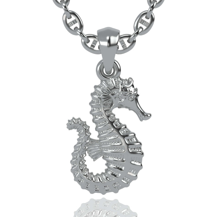 A lustrous 14k gold seahorse pendant is displayed against a white background. This elegant jewelry piece features textured lines and curves, accentuating the seahorse’s body and curled tail.