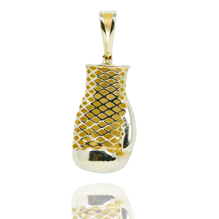 The Boxing Glove Pendant - 10k Gold features a diamond-patterned upper design that reflects light, standing upright against a white background—an elegant and striking piece of boxing jewelry.