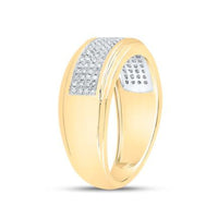 The 10K Yellow Gold Diamond Band Ring 1/3 Cttw features a wide band with a rectangular section adorned with rows of sparkling diamonds on the top and partially inside the band.
