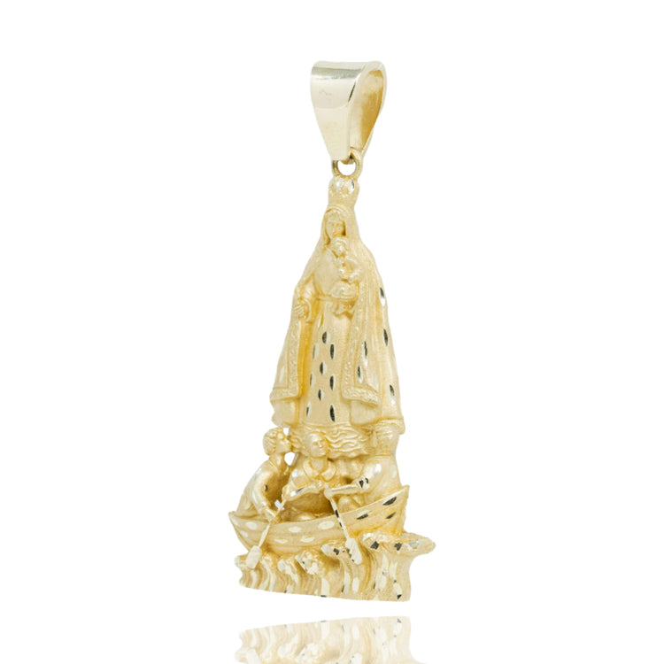 The Lady of Charity Large Pendant – Yellow Gold is a men’s religious pendant showing Our Lady of Charity in detailed relief above three figures in a boat. The polished gold design includes a bail for easy attachment to any chain.