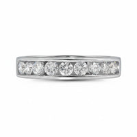 The 14k Gold Round Diamond Wedding Channel Set Band (1 Cttw) features seven round diamonds in a sleek channel setting, elegantly arranged in a shimmering row.