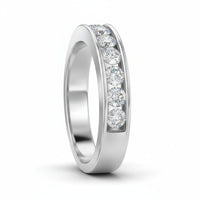 The 14k Gold Round Diamond Wedding Channel Set Band 1 Cttw features seven sparkling diamonds in a channel setting, shown on a plain white background.