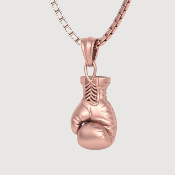 14K gold boxing glove pendant for men, symbolizing strength and resilience, handcrafted with exquisite detail and sophistication.