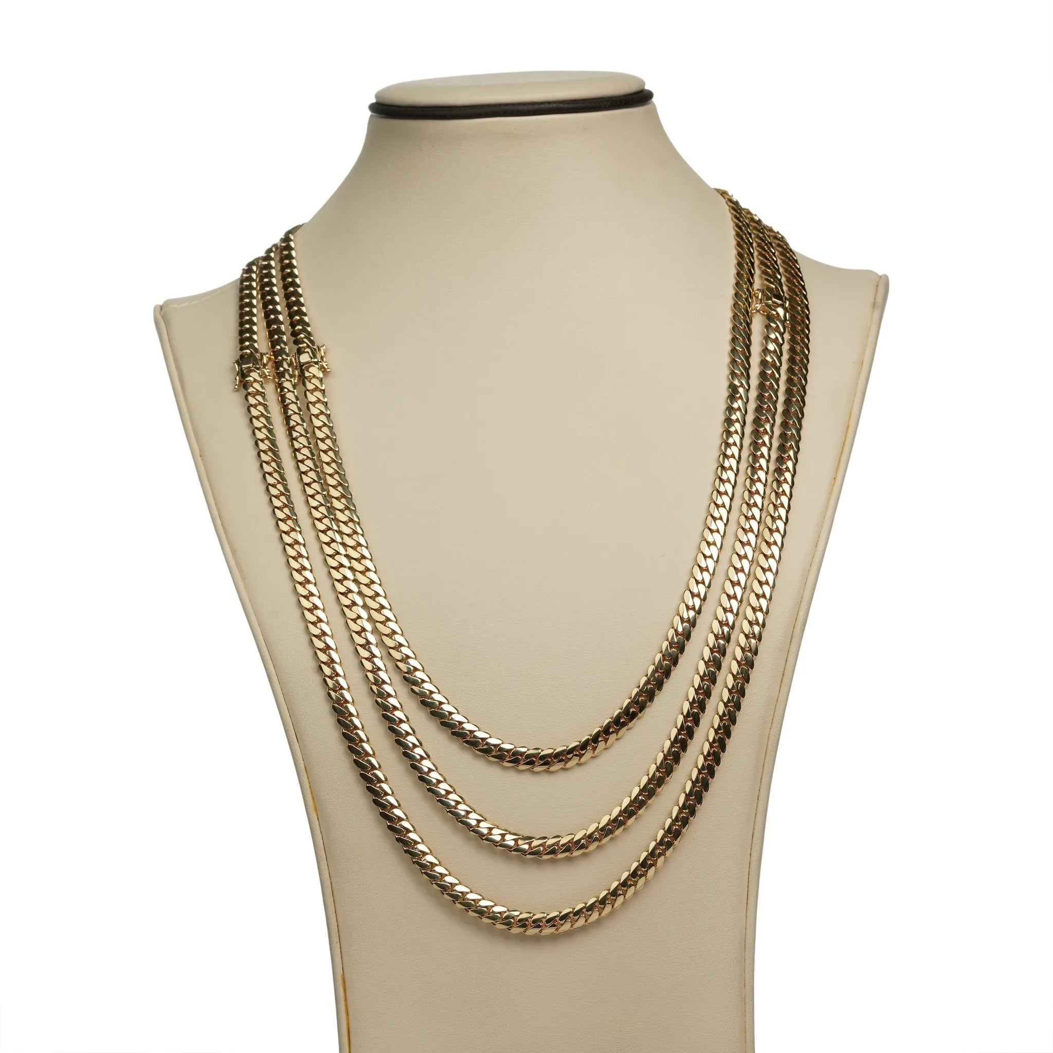 A beige jewelry bust showcases the 6mm Handmade Miami Cuban Link Chain in solid 10K/14K gold, featuring three rows of flat, interlocking links for an elegant, sophisticated layered look. Ready to ship.