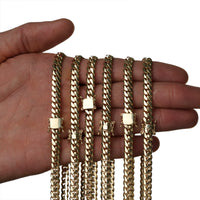 A hand displays the 6mm Handmade Miami Cuban Link Chain in 10K or 14K solid gold, featuring a sturdy box clasp. Set against a white background, this ready-to-ship piece highlights premium handmade Miami jewelry craftsmanship.