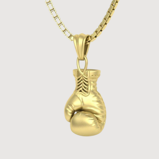 14K gold boxing glove pendant for men, symbolizing strength and resilience, handcrafted and luxurious accessory.