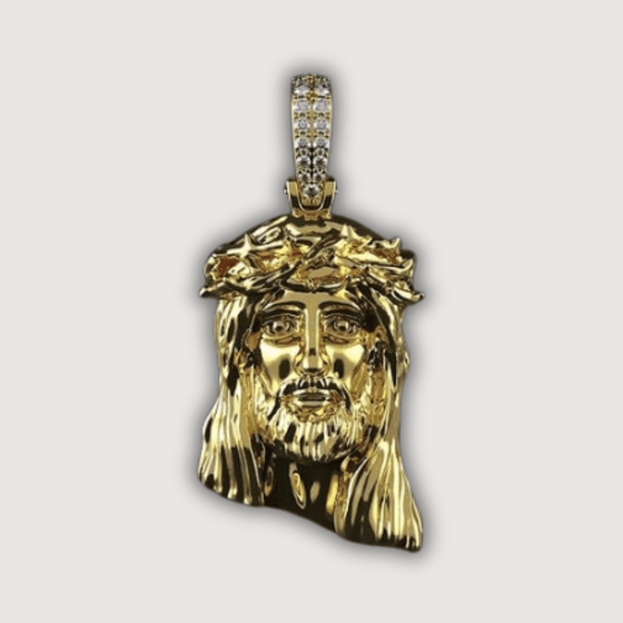 14K Gold Jesus Face Pendant with Diamond Bail featuring intricate craftsmanship and polished gold, embodying faith and luxury.