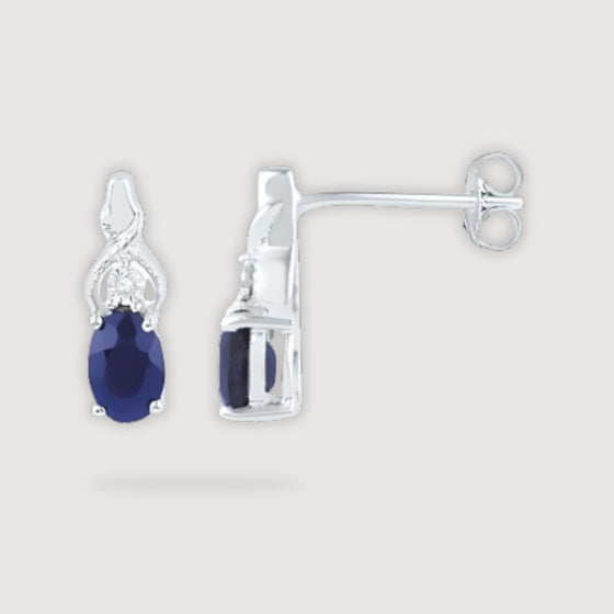 alt=" Discover versatile 10K gold earrings with synthetic blue sapphire that shine in any setting, perfect for elevating both casual and formal outfits. "