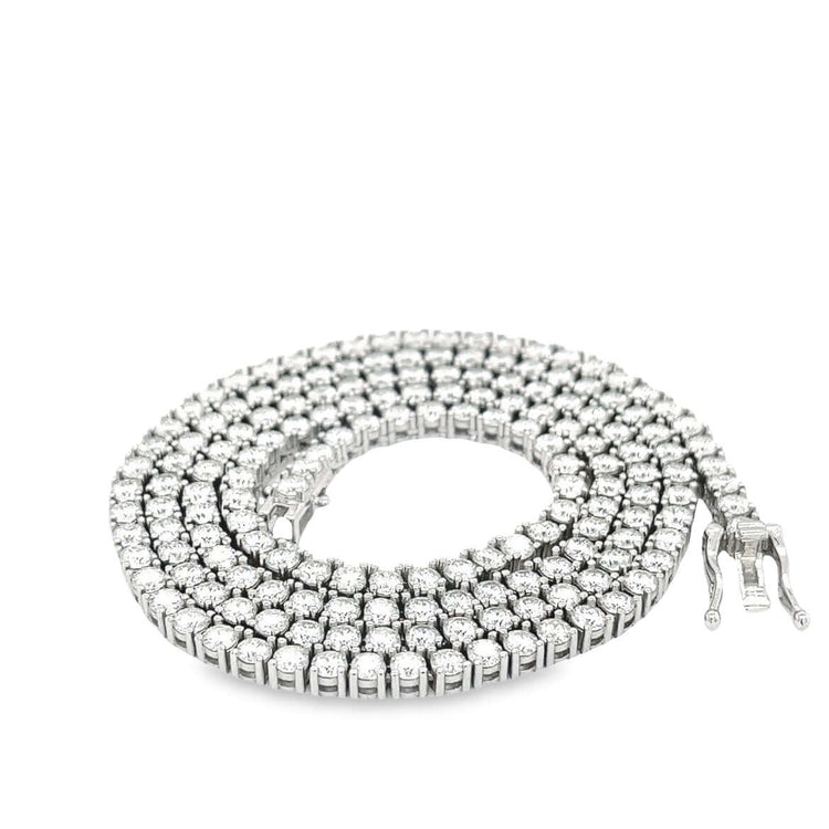 A coiled Tennis Chain crafted from 925 sterling silver and set with sparkling round-cut moissanite, shown on a white background.