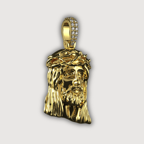 14K Gold Jesus Face Pendant with Diamond Bail, intricately designed and polished for elegance and spiritual expression.