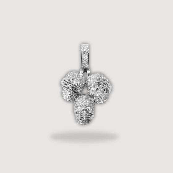 14k gold pendant featuring three skulls symbolizing hear no evil, see no evil, speak no evil, crafted in striking and detailed design.