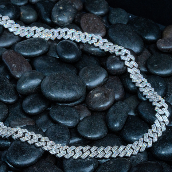 Shop 9mm Iced-Out Cuban Link Chain. Featuring 3 Row 16.57ctw Moissanite Diamond Stimulants and Set in Premium 925 Sterling Silver and Plated in Rhodium. 