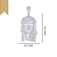 The Baguette Round Moissanite Jesus Religious Pendant features a 925 Sterling Silver Jesus face encrusted with moissanite stones, measuring 64.2 mm by 30.7 mm, displayed on a white background with a gold ribbon—a stunning religious accessory.