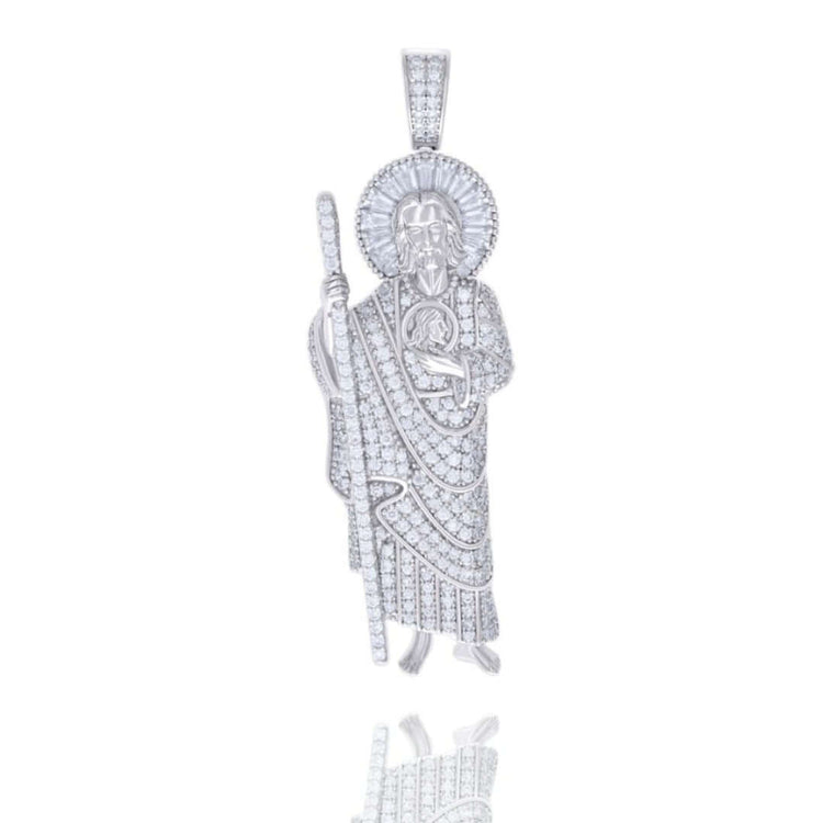The Baguette Round Moissanite St. Jude Religious Pendant is crafted in sterling silver, featuring a robed figure with a staff and halo, detailed craftsmanship, baguette and round moissanite accents, and a reflective finish.