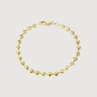 The Bead Bracelet - 3mm Moon Cut showcases small, round, textured moon cut beads in 14K solid yellow gold, linked together with a lobster clasp, displayed on a plain white background.