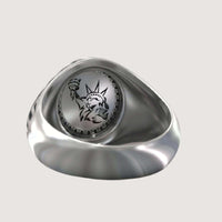 The Bold Eagle Liberty Statue Ring features an engraved image of the Statue of Liberty’s head and torch inside an oval setting on a smooth, polished band.