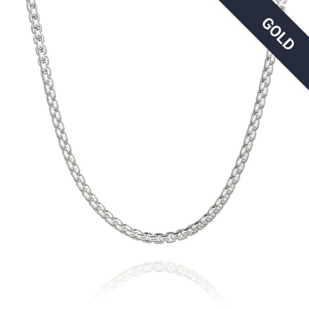 A 2mm Box Chain White Gold necklace with a sleek design is shown on a white background. A dark banner in the top right corner reads "GOLD" in white text.