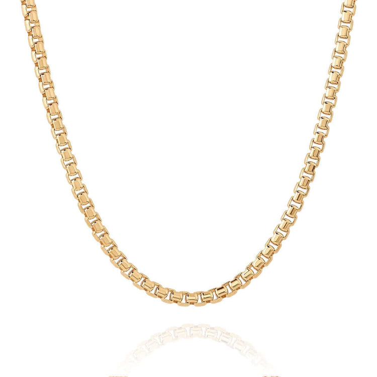 The Box Chain Yellow Gold - 2.5mm features polished square links and is shown in a gentle curve against a white background. Available in 10K or 14K gold.