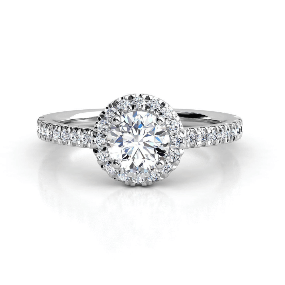 The Brilliance Halo Diamond Ring features a radiant round lab diamond center and pavé band, beautifully showcased against a crisp white background.
