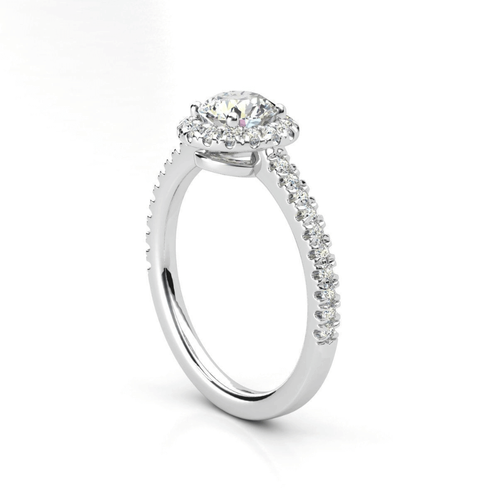 The Brilliance Halo Diamond Ring boasts a radiant round lab diamond center, encircled by a halo and set on a pavé white gold band—an elegant women’s engagement ring choice.