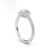 The Brilliance Halo Diamond Ring boasts a radiant round lab diamond center, encircled by a halo and set on a pavé white gold band—an elegant women’s engagement ring choice.