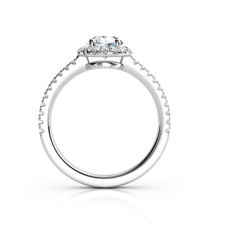 The Brilliance Halo Diamond Ring features a radiant round center diamond with pavé-set accents on the band and beneath the center stone, shown in white gold or platinum from a side view.