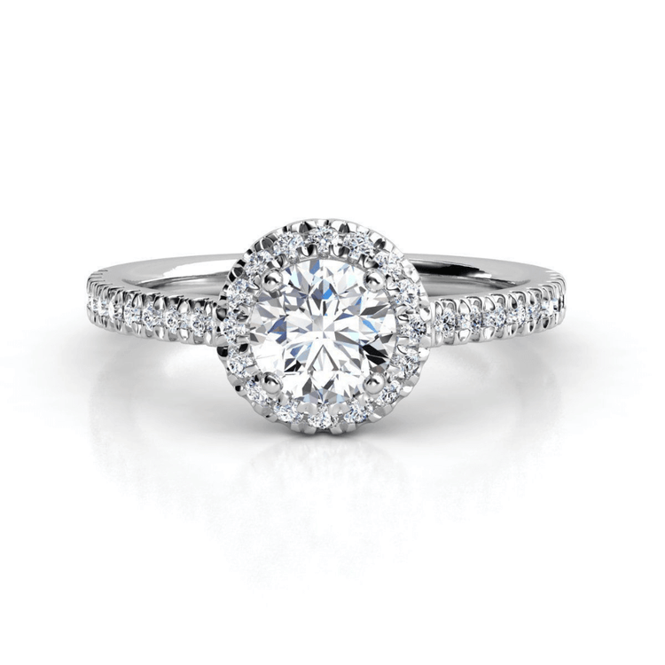 The Brilliance Halo Diamond Ring features a radiant round lab diamond center and pavé band, beautifully showcased against a crisp white background.
