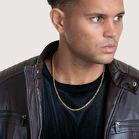 A man wearing a leather jacket accessorizes with a stylish Cable Link Chain - 5mm.