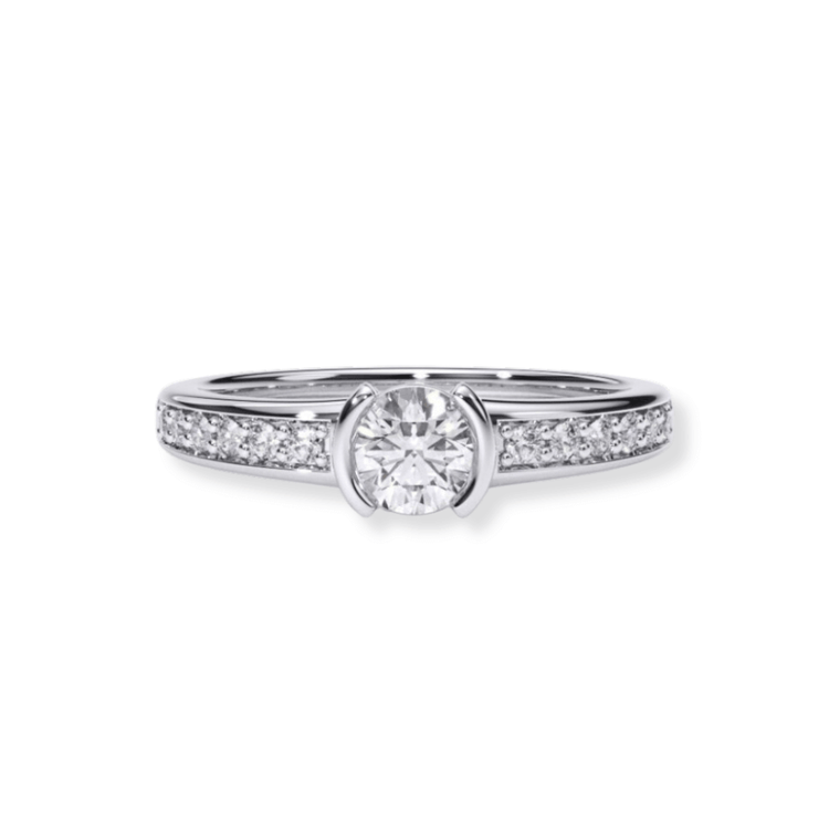 The Classic Channel-Set Lab Diamond Engagement Ring features a brilliant round center lab diamond and smaller channel-set diamonds along the band, displayed on a white background for an elegant, timeless look.