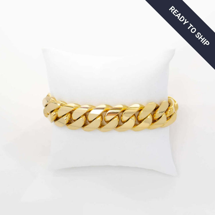 The Handmade Miami Cuban Link Bracelet—crafted from solid gold—rests on a white cushion, with a dark corner banner stating "READY TO SHIP.