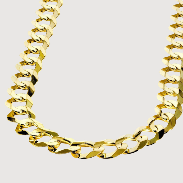 A close-up of the Curb Link Chain - 2mm-5.5mm Solid Yellow Gold, featuring a polished yellow gold design and classic curb links, showcased against a plain white background.