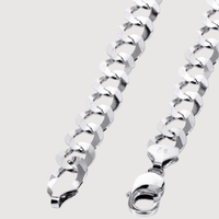 Close-up of a shiny Curb Link Chain - 2mm-5mm Solid White Gold bracelet featuring rectangular and angled links, shown with a lobster clasp fastener on a plain light background.